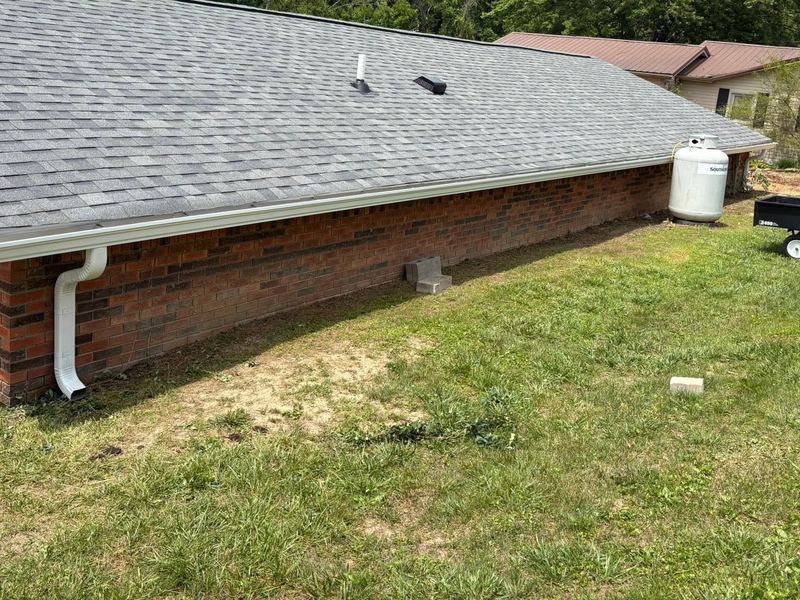 New gutter run and downspout on a brick home near Louisville, KY